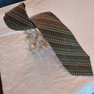 100% Silk Tie by Rooster in a Classic Herringbone Weave Pattern.